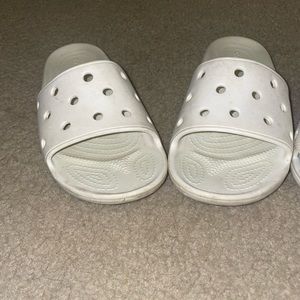 white Crocs worn a lot but could be cleaned no tears, stable shoes